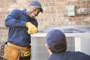 two-technicians-working-on-ac-unit