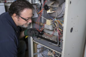 technicians-examining-gas-furnace